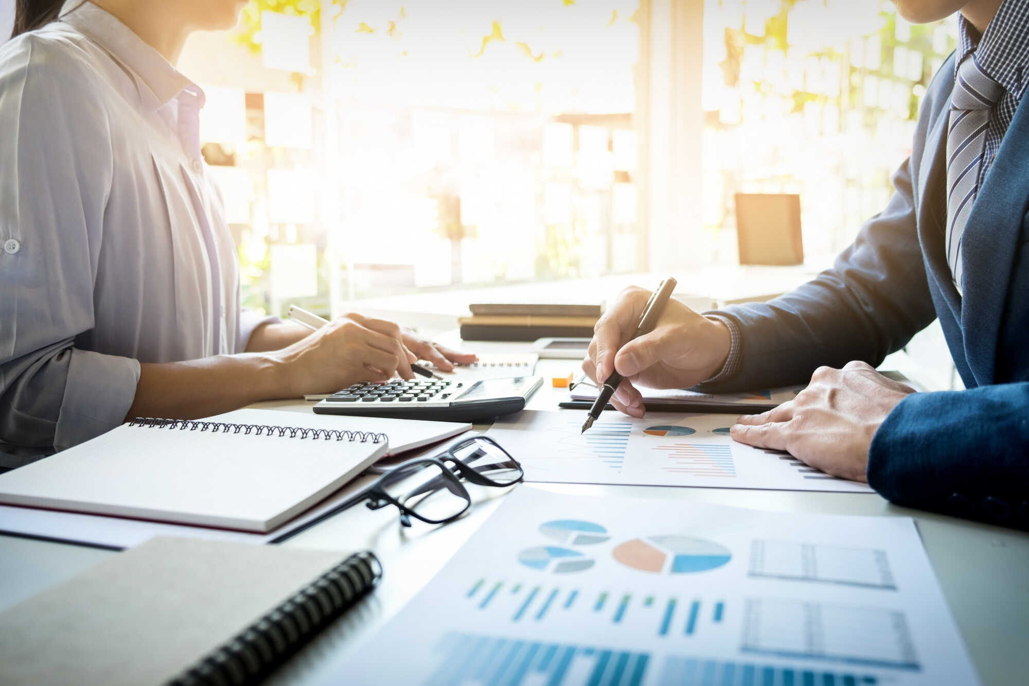 business-man-financial-inspector-and-secretary-making-report-calculating-or-checking-balance-internal-revenue-service-inspector-checking-document-audit-concept_optimized
